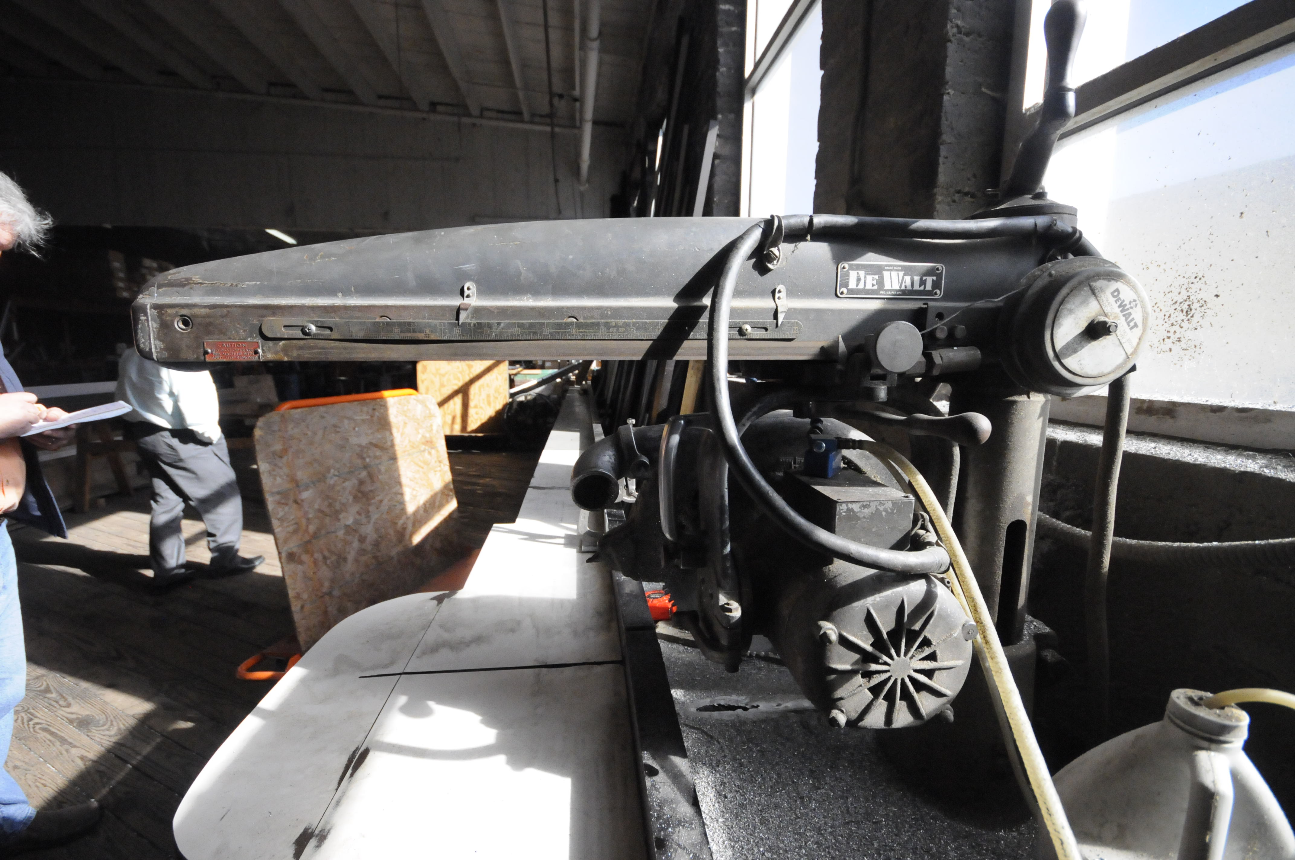 An old De Walt 15-inch saw is still used to cut aluminum framing at Hubbuch Glass.