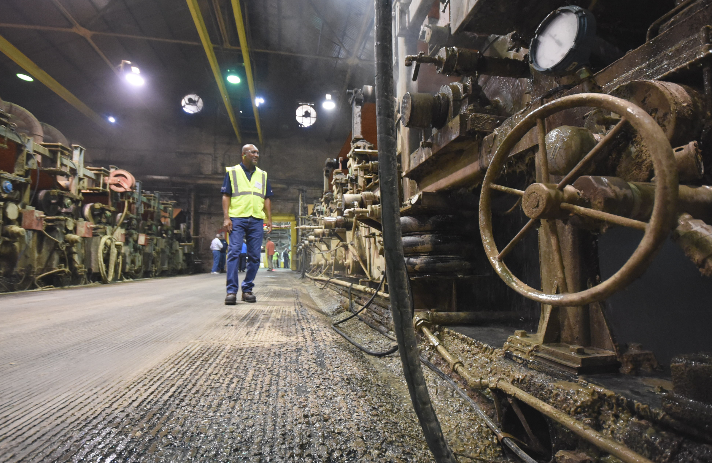 WestRock (Chattanooga) paper making machine, circa 1917, back tender Mike Long checks the operation Friday during 100th birthday ceremonies at the North Chattanooga plant.
