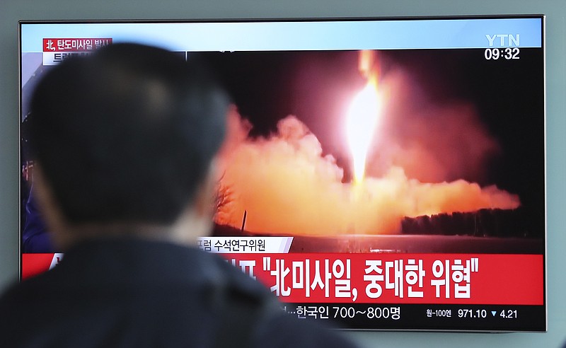 A man watches a TV screen showing a local news program reporting with a file footage of North Korea's missile launch, at the Seoul Railway Station in Seoul, South Korea, Wednesday, Nov. 29, 2017.