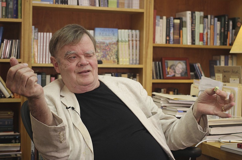 FILE - In this July 26, 2017 file photo, Garrison Keillor, creator and former host of, "A Prairie Home Companion," talks at his St. Paul, Minn., office.