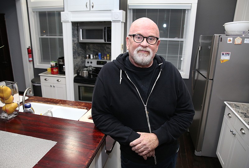 Phil Cross poses for a photo in the kitchen of his Chattanooga, Tenn., home Wednesday, Nov. 29, 2017. One thing that sets Cross apart from many Airbnb hosts in the Chattanooga area is that heճ paid sales tax to the state and Ңed taxӠto the city and county since he started renting out rooms about two years ago.