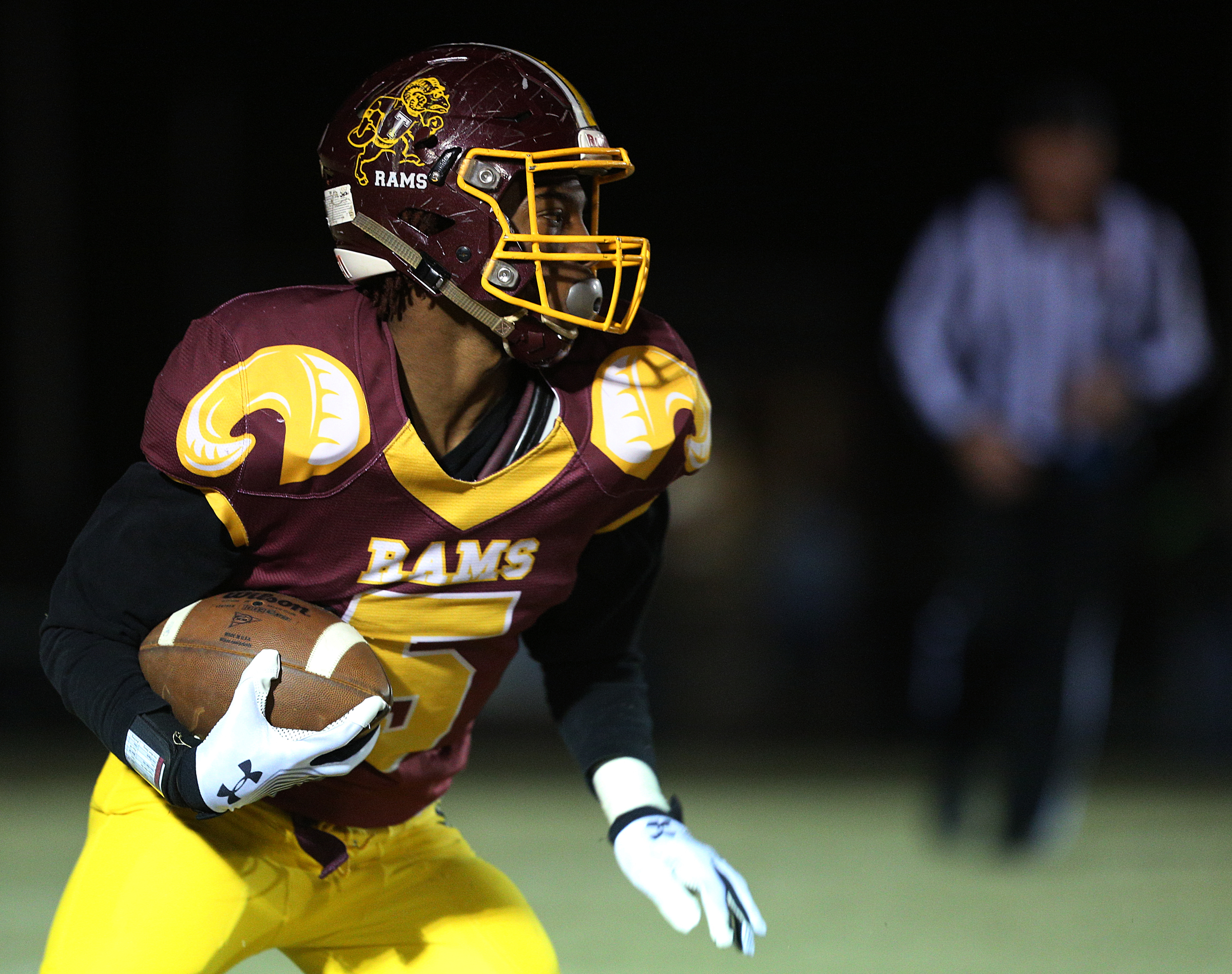 Tyner's Ke'Un Webb (5) looks for a path downfield during the Class 2A quarterfinal football game between Tyner and Marion County Friday, Nov. 17, 2017 in Bob Evans Stadium at Tyner High School.
