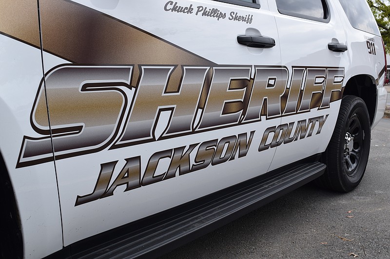 A Jackson County Sheriff's Office patrol car is shown.