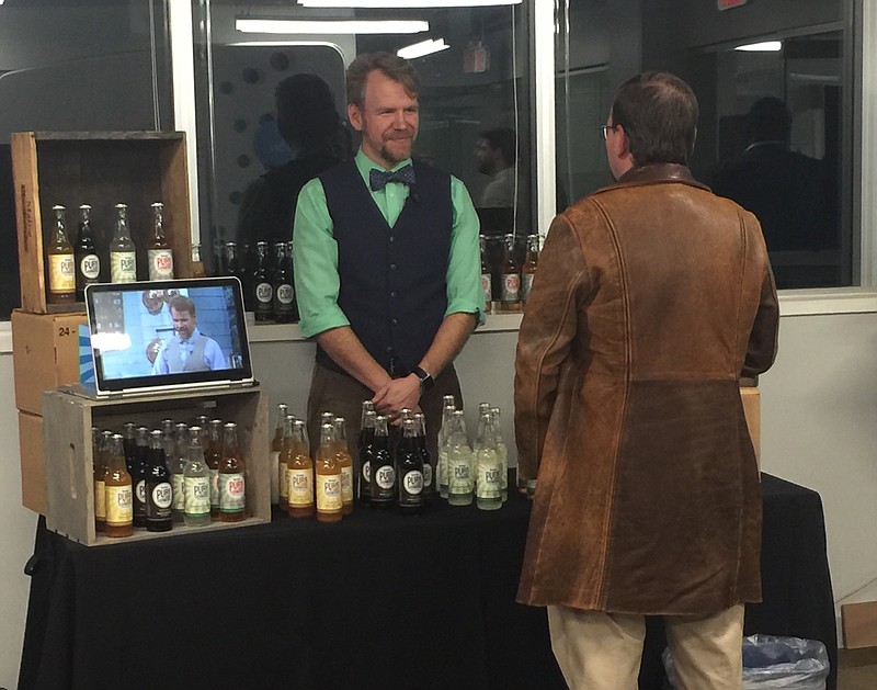 Pure Sodaworks co-founder and CEO Matt Rogers talks with a customer during Pitch Night at The Company Lab.