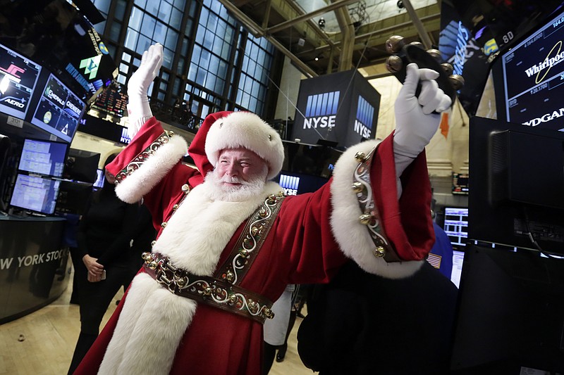 FILE - In this Wednesday, Nov. 25, 2015, file photo, Santa Claus visits the trading floor of the New York Stock Exchange before the opening bell. Stocks have already exceeded most expectations in 2017, and it looks like Santa Claus will drop by to give investors another gift before the year comes to a close. (AP Photo/Richard Drew, File)