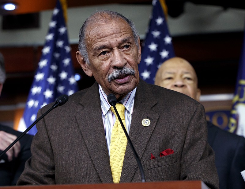 FILE -- In this file photo from Tuesday, Feb. 14, 2017, Rep. John Conyers, D-Mich., flanked by other top Democrats, speaks at a news conference on Capitol Hill in Washington.