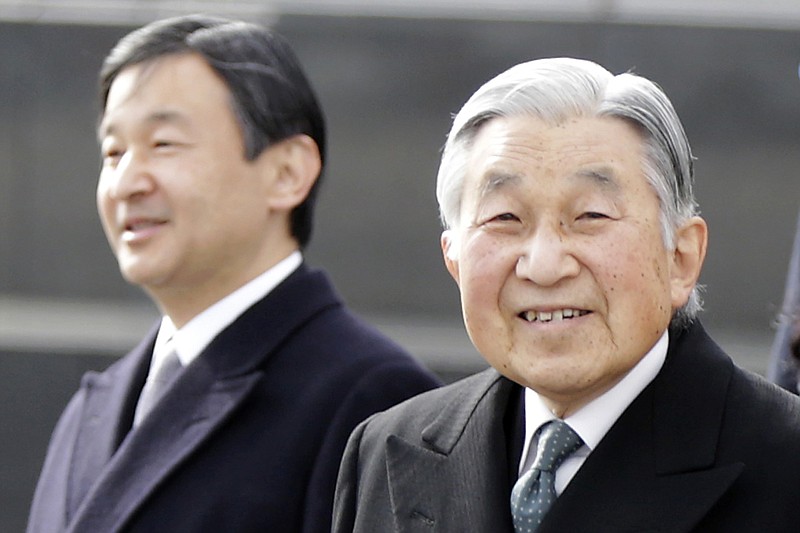 In this Jan. 26, 2016, file photo, Japan's Emperor Akihito, right, and Crown Prince Naruhito, left, walk at Haneda international airport in Tokyo. Japan's Prime Minister Shinzo Abe said Friday, Dec. 1, 2017, Emperor Akihito plans to abdicate on April 30, 2019, in the first such abdication in about 200 years. The emperor will be 85 by then.(AP Photo/Eugene Hoshiko, File)