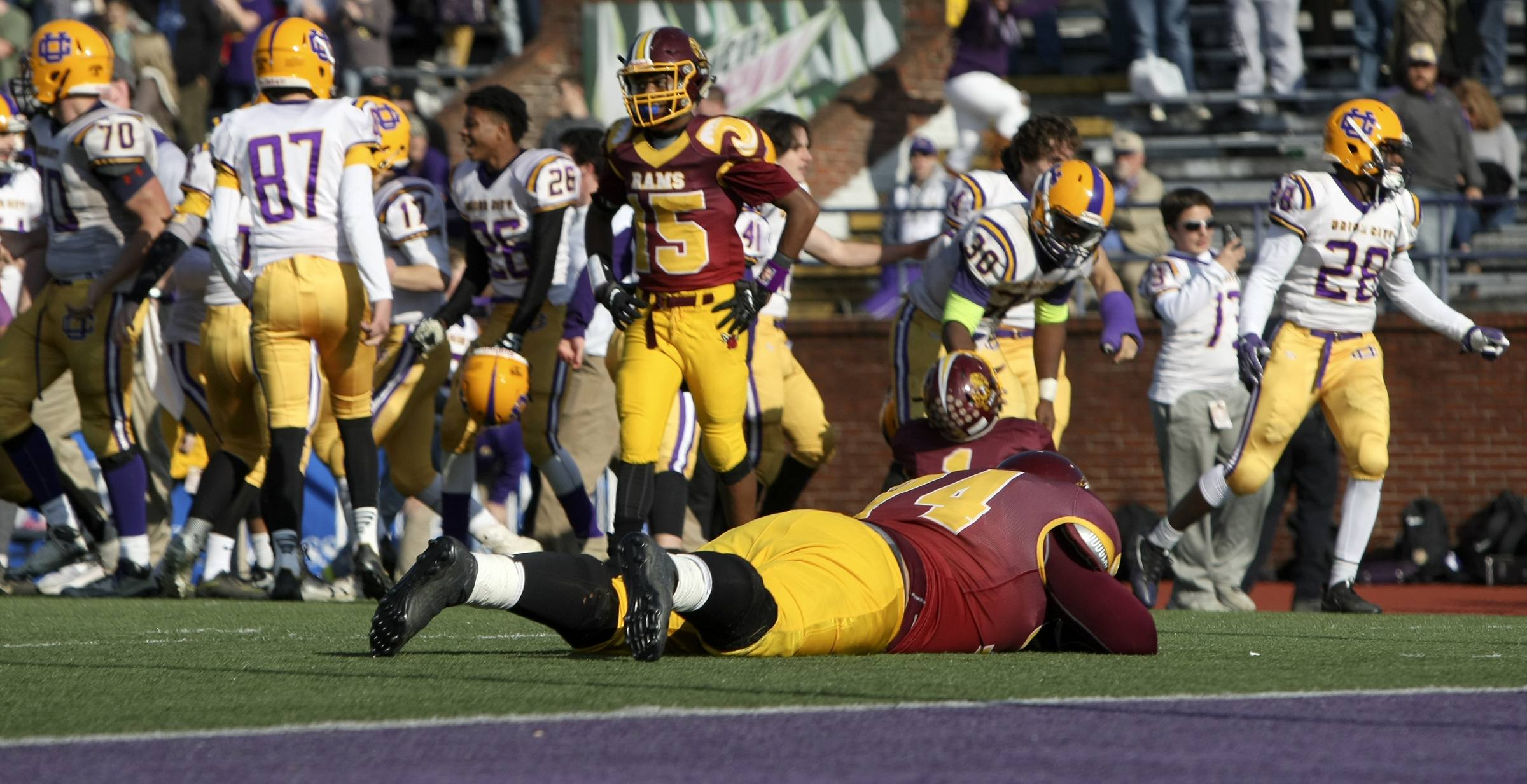 As Union City celebrates their double-overtime win in the Class 2A BlueCross Bowl state championship, Tyner's Anthony Goodwin (74) lies on the turf at Tennessee Technological University's Tucker Stadium on Friday, Dec. 1, 2017 in Cookeville, Tenn.