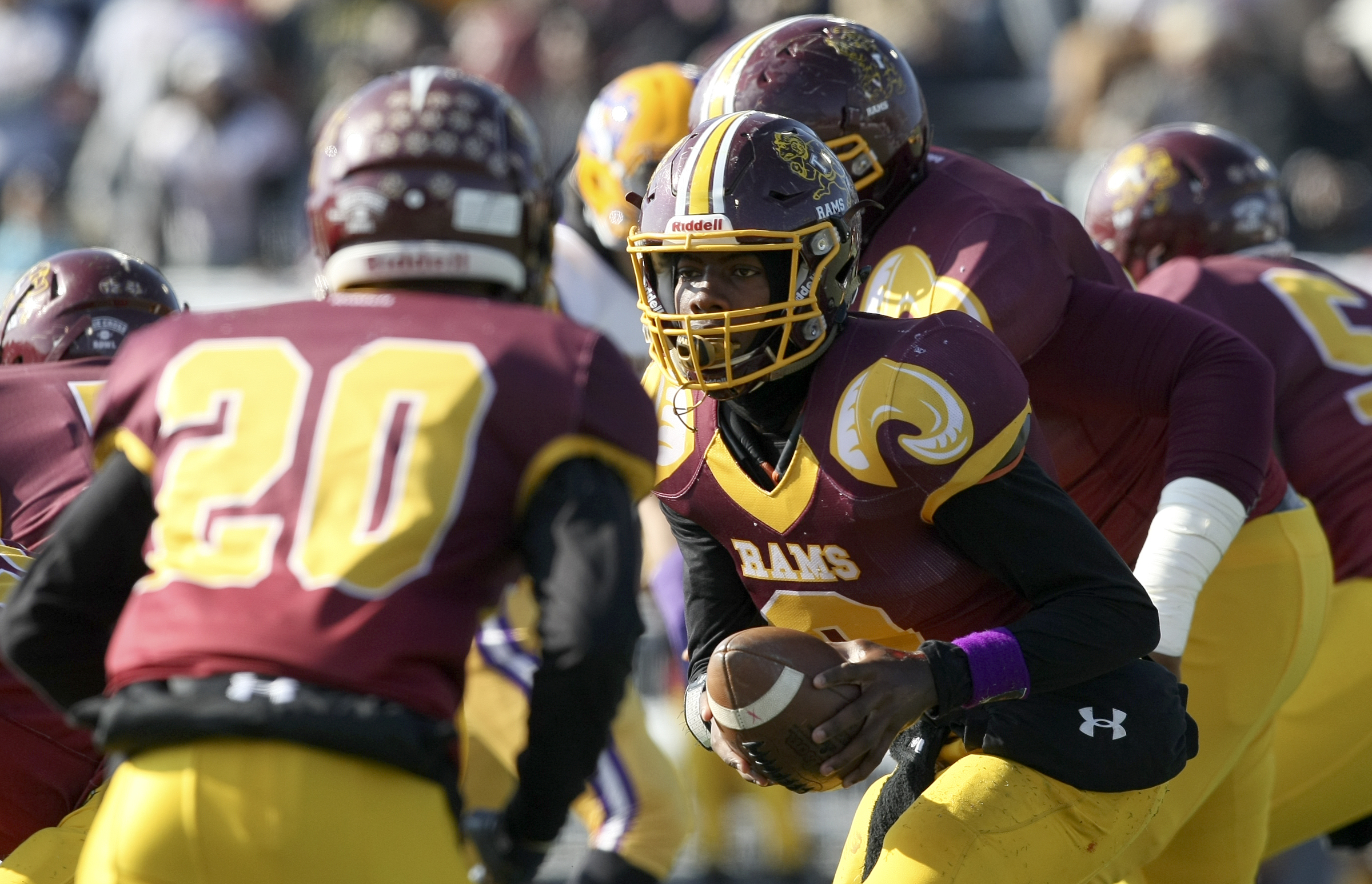 Tyner's Jaylen Bowens (8) goes to hand the ball off to Jeremy Elston (20) during the Class 2A BlueCross Bowl state championship against Union City at Tennessee Technological University's Tucker Stadium on Friday, Dec. 1, 2017 in Cookeville, Tenn.