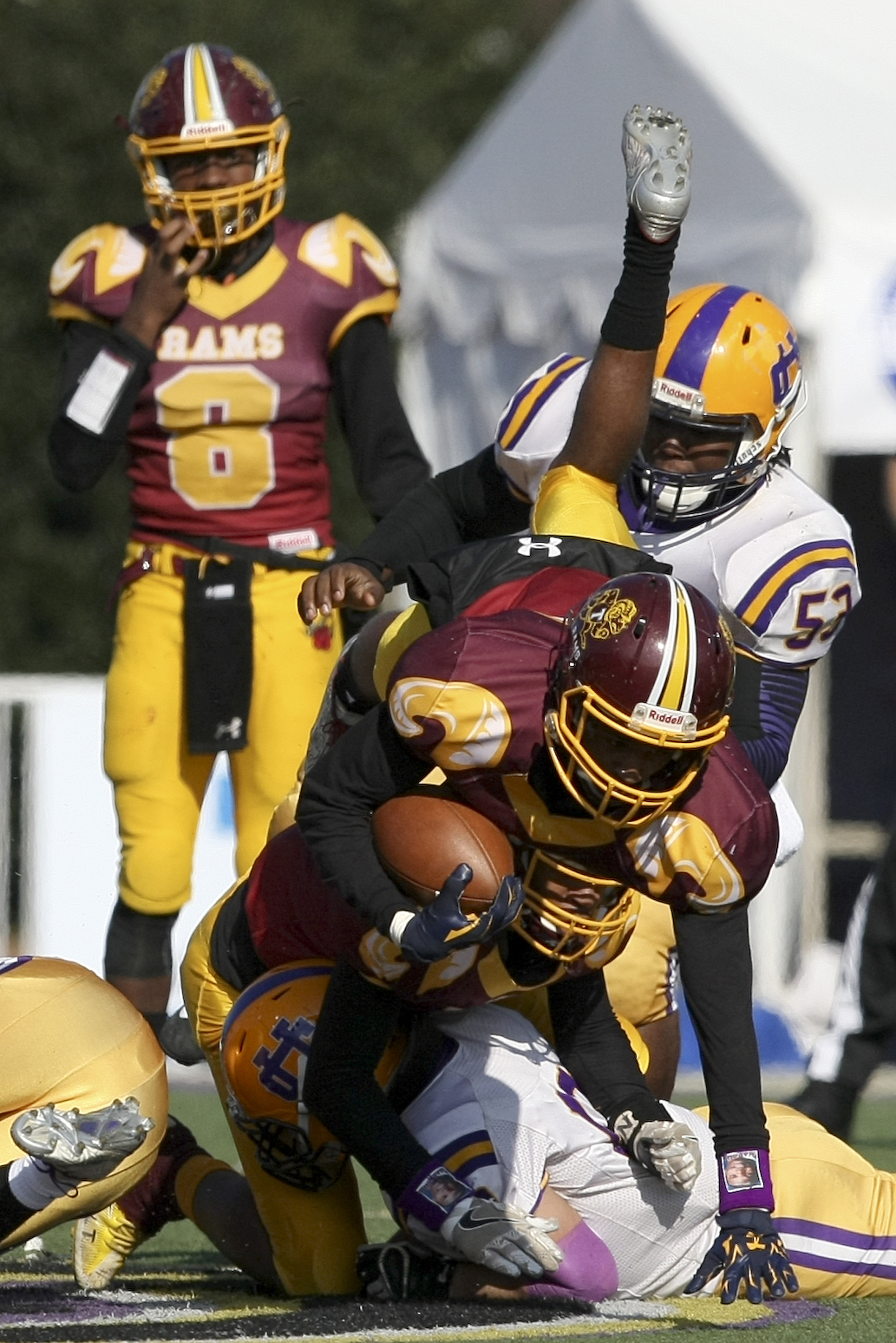 Tyner's Jeremy Elston (20) is upended against Union City during the Class 2A BlueCross Bowl state championship at Tennessee Technological University's Tucker Stadium on Friday, Dec. 1, 2017 in Cookeville, Tenn.