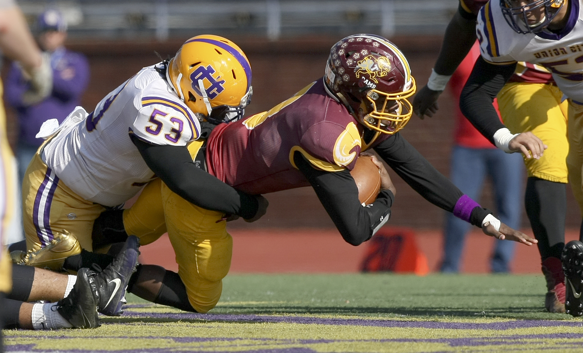 Union City's James Ingram (53) tackles Tyner's Jaylen Bowens (8) during the Class 2A BlueCross Bowl state championship at Tennessee Technological University's Tucker Stadium on Friday, Dec. 1, 2017 in Cookeville, Tenn.