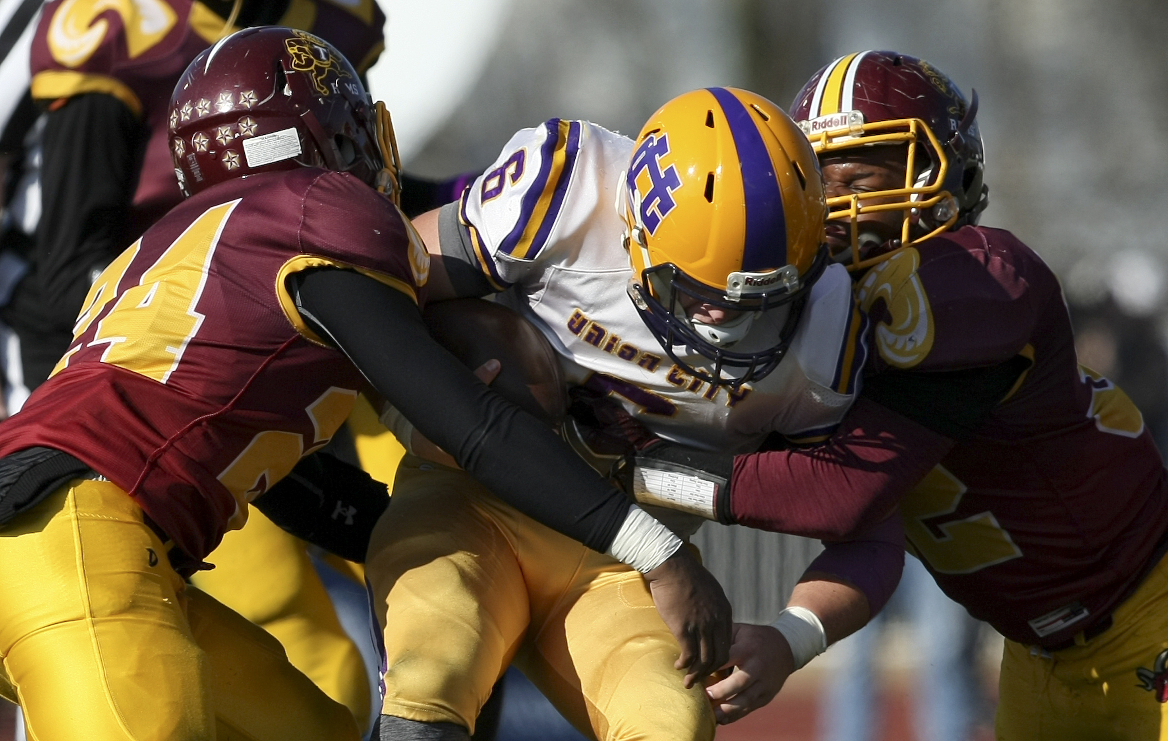 Tyner's James Parks (24) and Kamden Edwards (32) tackle Union City's Braxton Waddell (6) during the Class 2A BlueCross Bowl state championship at Tennessee Technological University's Tucker Stadium on Friday, Dec. 1, 2017 in Cookeville, Tenn.