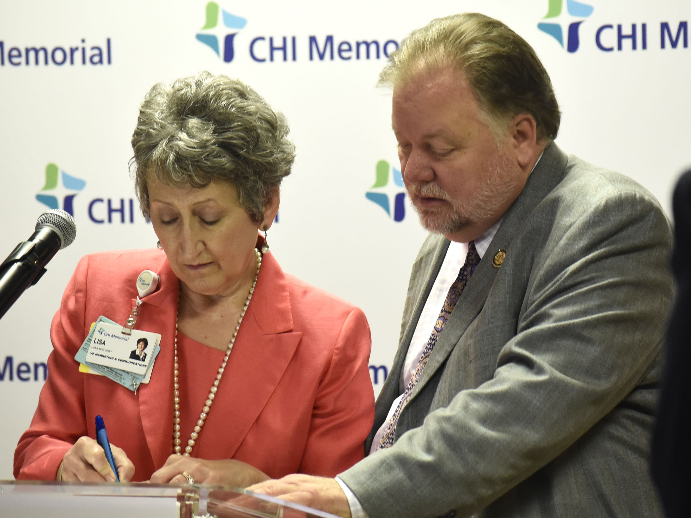 From left, CHI Memorial Vice President for Marketing and Communications Lisa McCluskey confers with Jeff Mullis, State Senator and President and CEO of Northwest Georgia Joint Development Authority, before the announcement. CHI Memorial Hospital will purchase Cornerstone Medical Center in late December, CEO Larry Schumacher announced December 1, 2017. In addition, CHI Memorial will purchase the former Hutcheson Medical Center ambulatory surgery center, located on Battlefield Parkway in Ringgold. The center has been owned by Regions Bank since Hutcheson shut down. on December 1, 2017.