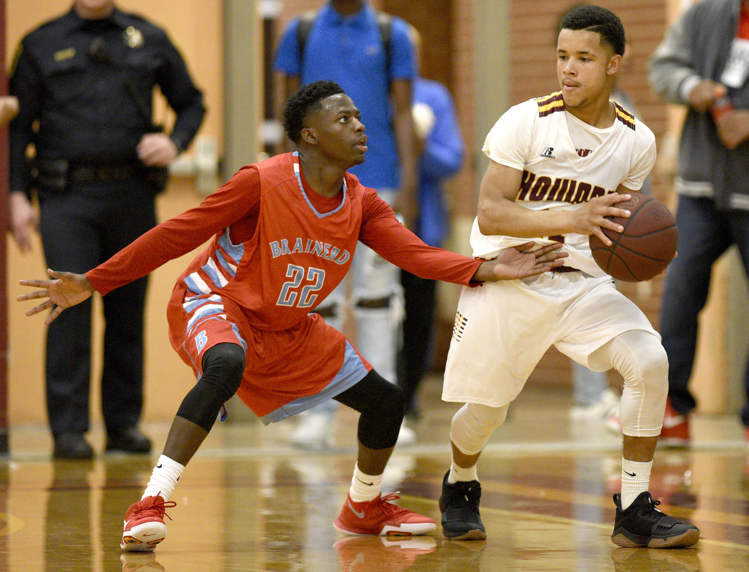 Brainerd's Michael Hampton (22) defends against Howard's Dewayne Lowery (11). The Brainerd Panthers visited the Howard Hustling Tigers in TSSAA basketball action on December 1, 2017.