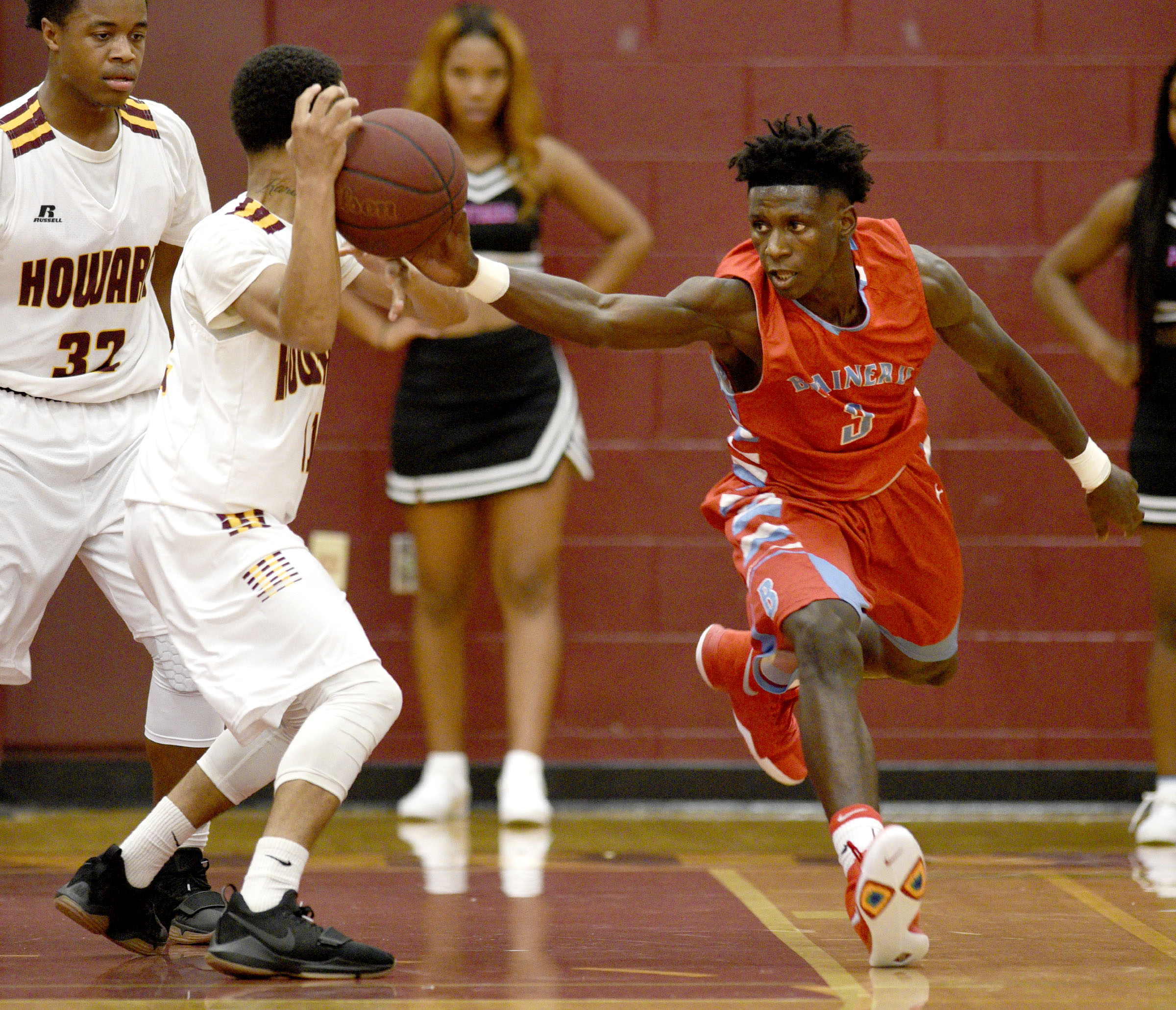 Brainerd's Joseph Norwood (3) steals the ball from Howard's Dewayne Lowery (11). The Brainerd Panthers visited the Howard Hustling Tigers in TSSAA basketball action on December 1, 2017.