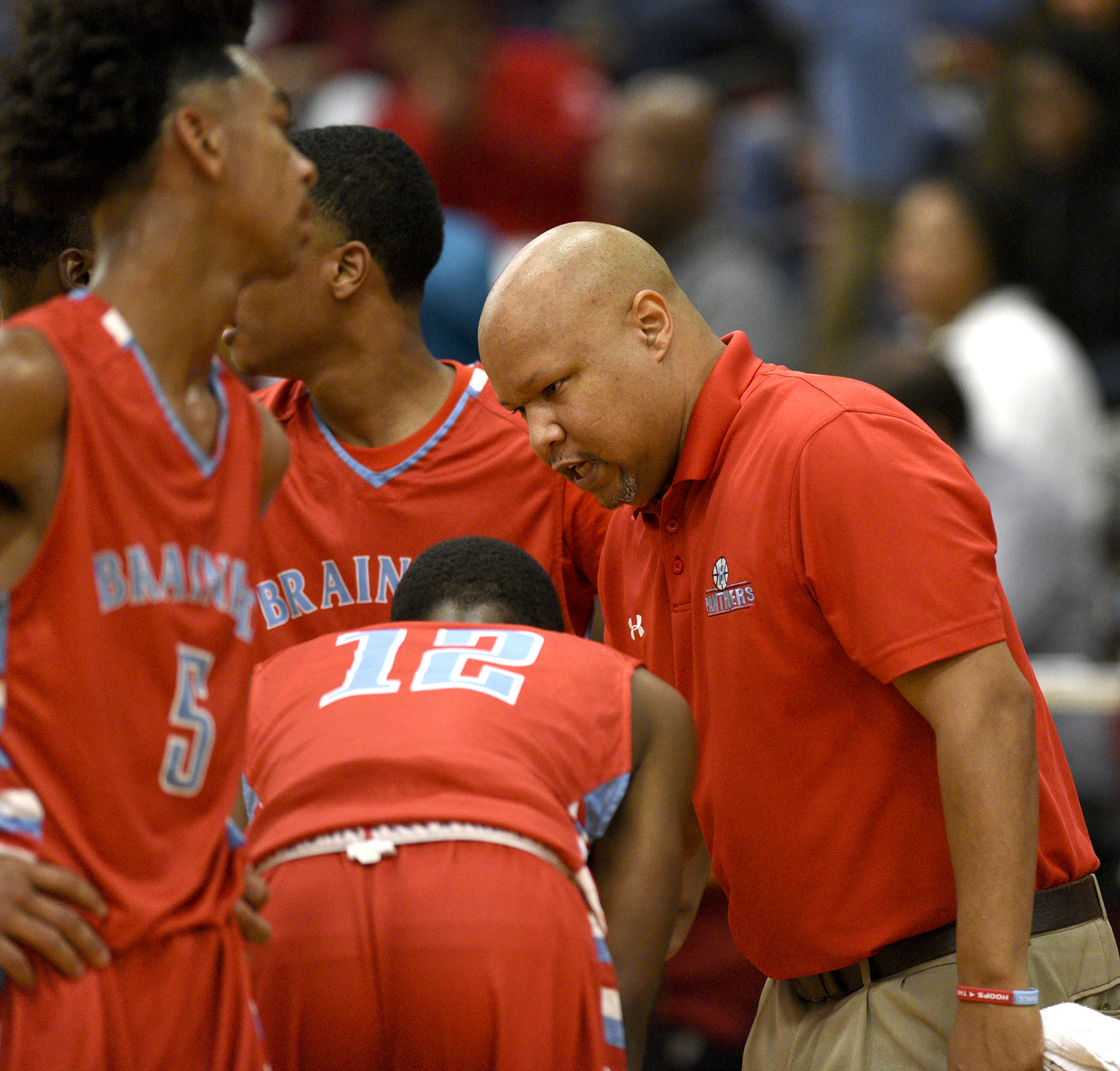 Brainerd coach Levar Brown instructs his team during a timeout. The Brainerd Panthers visited the Howard Hustling Tigers in TSSAA basketball action on December 1, 2017.