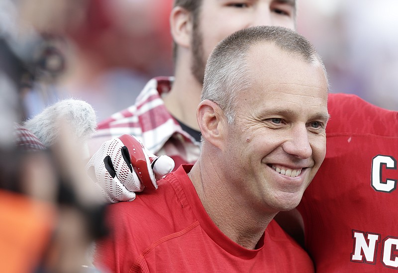 North Carolina State's head coach Dave Doeren smiles prior to an NCAA college football game against North Carolina in Raleigh, N.C., Saturday, Nov. 25, 2017. (AP Photo/Gerry Broome)