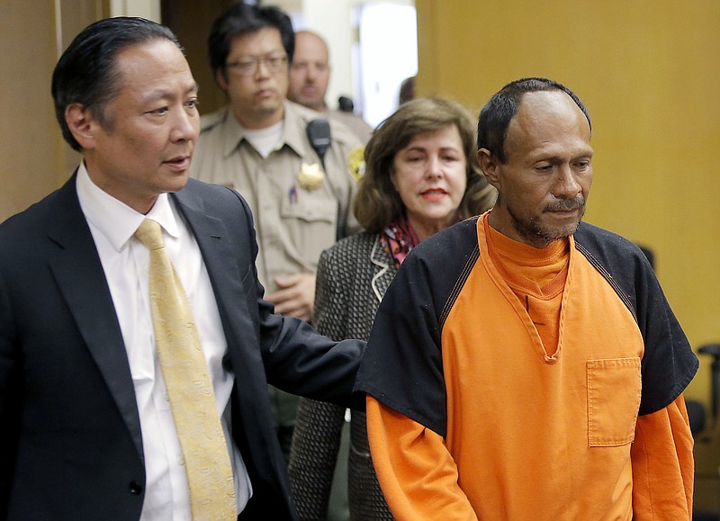 In this July 7, 2015, file photo, Jose Ines Garcia Zarate, right, is led into the courtroom by San Francisco Public Defender Jeff Adachi, left, and Assistant District Attorney Diana Garciaor, center, for his arraignment at the Hall of Justice in San Francisco. A jury has reached a verdict Thursday, Nov. 30, 2017, in the trial of Mexican man at center of immigration debate in the San Francisco pier shooting. (Michael Macor/San Francisco Chronicle via AP, Pool, File)