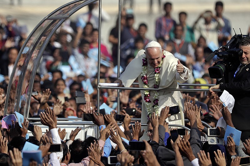 Pope Francis celebrates mass and the ordination of new priests at the Suhrawardy Udyan park, in Dhaka, Bangladesh, Friday, Dec. 1, 2017. (AP Photo/Andrew Medichini)