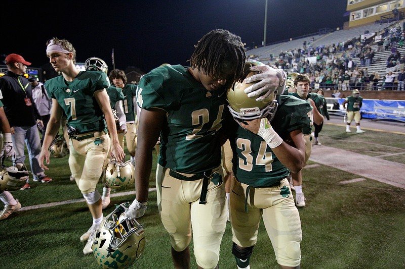 Notre Dame's Akil Sledge (24) comforts teammate Jeffrey Watkins Jr. (34) after the Irish's Division II-AA state championship football loss to Lausanne at Tennessee Tech University on Saturday, Dec. 2, 2017, in Cookeville, Tenn. Notre Dame took runner-up after falling 41-13.