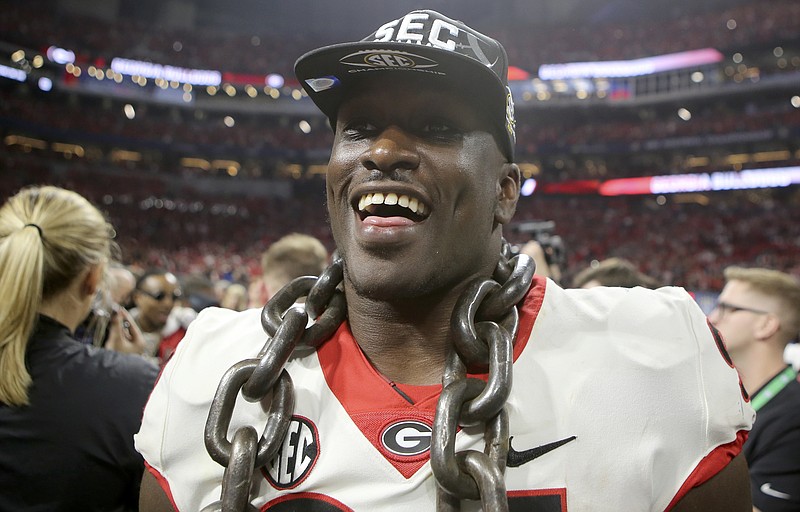 Georgia defensive tackle Michael Barnett (94) celebrates after the Bulldogs defeated the Auburn Tigers 28-7 to win the Southeastern Conference championship at Mercedes-Benz Stadium on Saturday, Dec. 2, 2017 in Atlanta, Ga.