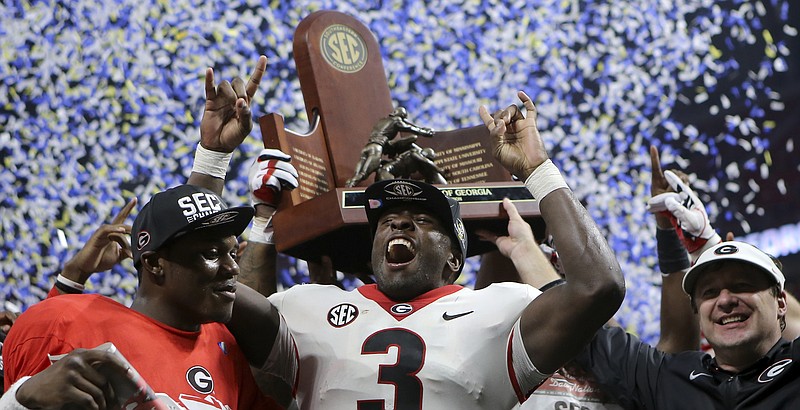 Game MVP Roquan Smith (3) celebrates after Georgia defeated Auburn 28-7 to win the Southeastern Conference championship at Mercedes-Benz Stadium on Saturday, Dec. 2, 2017 in Atlanta, Ga.