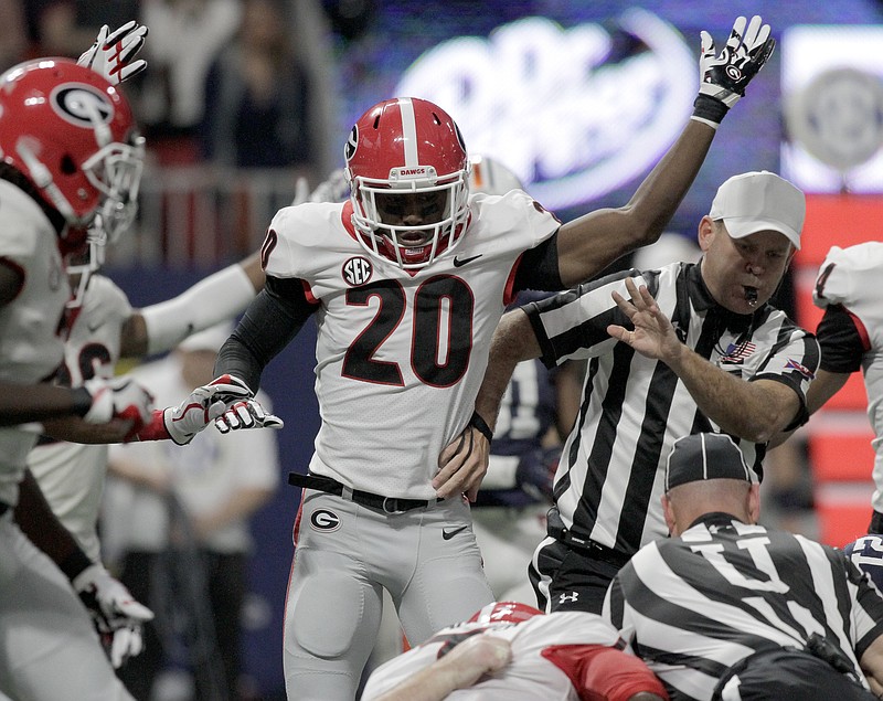 Georgia defensive back J.R. Reed (20) signals that Georgia had recovered a fumble during the Southeastern Conference championship against Auburn at Mercedes-Benz Stadium on Saturday, Dec. 2, 2017 in Atlanta, Ga.