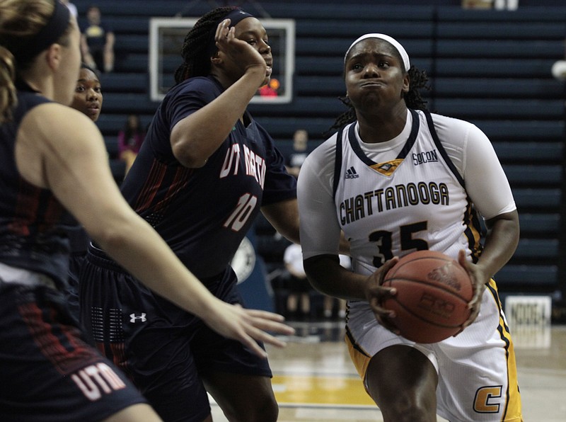 The University of Chattanooga's Aryanna Gilbert	(35) drives against UT Martin's Janekia Mason (10) during their match up at McKenzie Arena on Saturday. The Chattanooga Mocs took on UT Martin at home on Saturday, Dec. 2. 