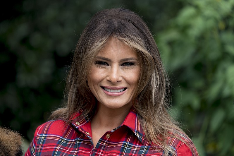 FILE - In this Sept. 22, 2017, file photo, first lady Melania Trump smiles during an event in the White House Kitchen Garden on the South Lawn of the White House in Washington. Melania Trump appears to becoming more at ease with her role as first lady. She is beginning to speak out more about how she envisions using her platform to help children in ways beyond cyberbullying.  (AP Photo/Andrew Harnik)