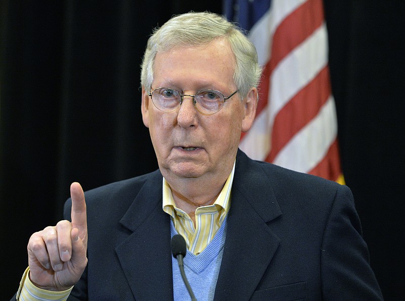 Senate Majority Leader Mitch McConnell, R-Ky., answers a reporters question during a news conference Saturday, Dec. 2, 2017, in Louisville, Ky.