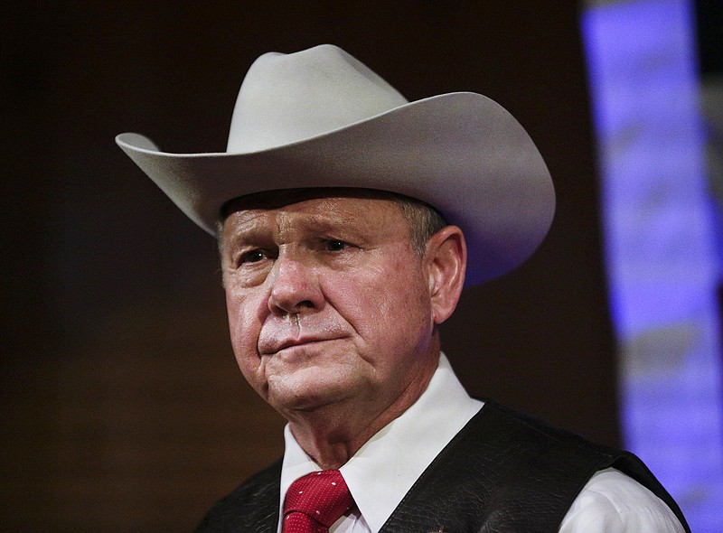 In this Monday, Sept. 25, 2017, file photo, former Alabama Chief Justice and U.S. Senate candidate Roy Moore speaks at a rally, in Fairhope, Ala. In the face of sexual misconduct allegations, Moore's U.S. Senate campaign has been punctuated by tense moments and long stretches without public appearances. Moore faces Democrat Doug Jones for Alabama's U.S. Senate seat in the Dec. 12 election. (AP Photo/Brynn Anderson, File)