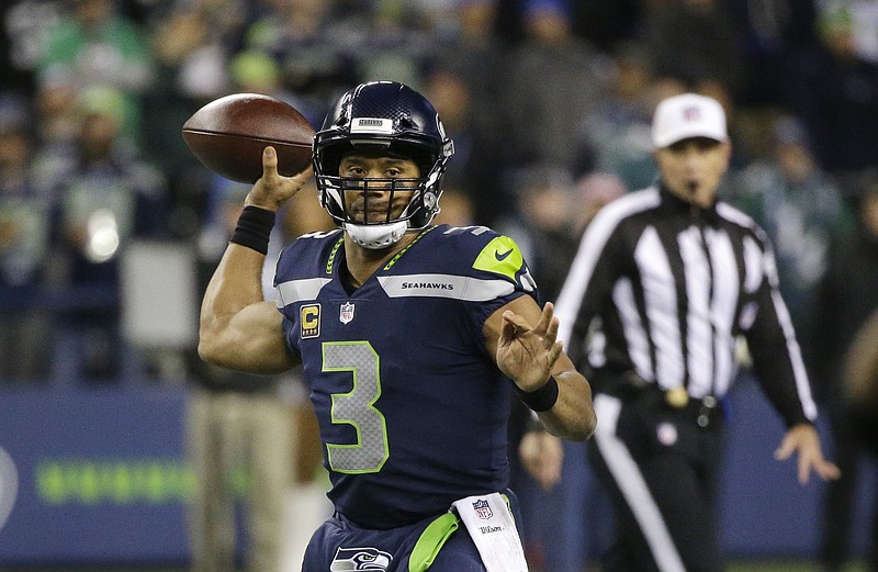 Seattle Seahawks quarterback Russell Wilson drops back to pass against the Philadelphia Eagles during the first half of an NFL football game, Sunday, Dec. 3, 2017, in Seattle. (AP Photo/Ted S. Warren)