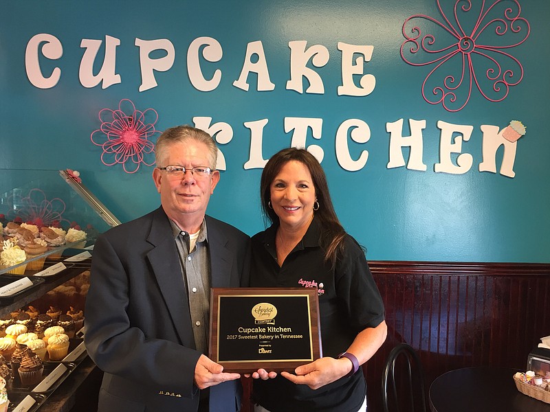 Cupcake Kitchen owner Helene Grzybowski accepts a plaque recognizing the downtown Chattanooga bakery as the 2017 Sweetest Bakery in Tennessee from bakery supplier Dawn Foods. (Contributed photo)