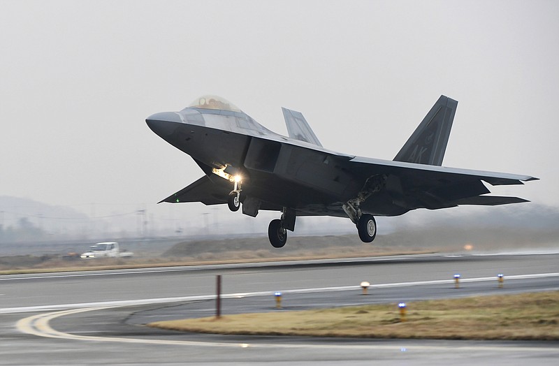A U.S. Air Force F-22 Raptor takes off from a South Korean air base in Gwangju, South Korea, Monday, Dec. 4, 2017. The United States and South Korea have started their biggest-ever joint air force exercise with hundreds of aircrafts including two dozen stealth jets. (Yonhap via AP)