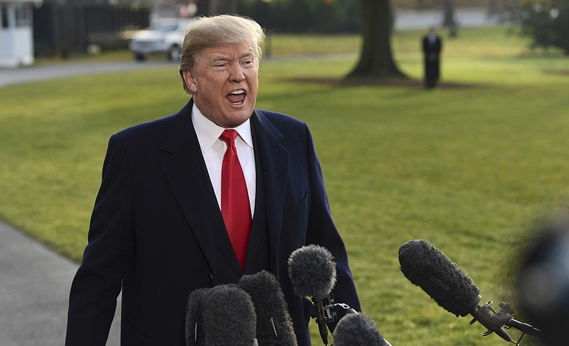 President Donald Trump speaks to reporters before boarding Marine One on the South Lawn of the White House in Washington, Monday, Dec. 4, 2017, before heading to Utah. Trump will be announcing plans to scale back two sprawling national monuments in Utah, responding to what he has condemned as a "massive federal land grab" by the government. (AP Photo/Susan Walsh)
