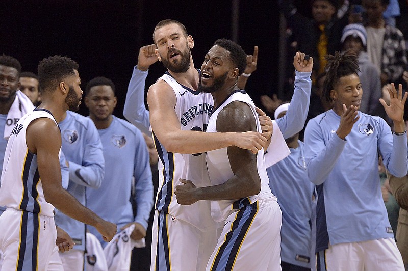 Memphis Grizzlies center Marc Gasol, center left, and forward JaMychal Green, center right, celebrate with teammates after an NBA basketball game against the Minnesota Timberwolves Monday, Dec. 4, 2017, in Memphis, Tenn. The Grizzlies won 95-92. (AP Photo/Brandon Dill)