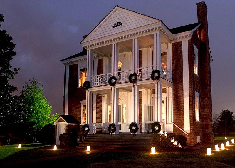 Luminarias light the pathways between Vann House and its museum. (Contributed Photo)