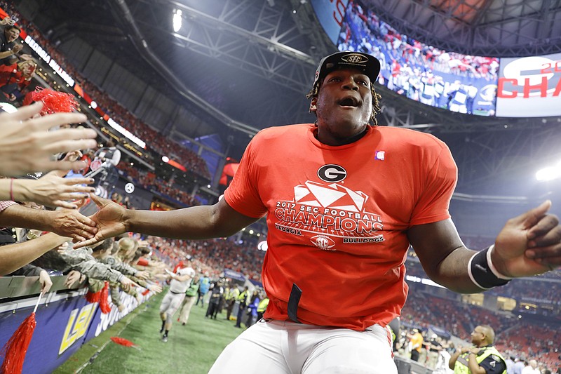 Georgia freshman offensive lineman Isaiah Wilson, who is redshirting this season, celebrates last Saturday's win over Auburn in the SEC championship game.