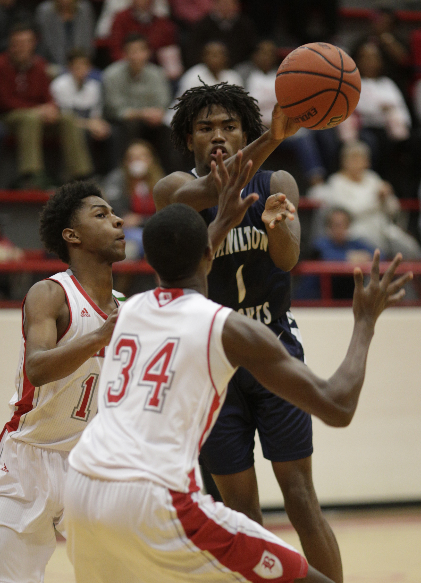 Hamilton Heights' Kevaughn Ellis (1) passes away from Baylor's Randy Brady (34) and Beyuan Hendricks during their prep basketball game at Baylor School on Tuesday, Dec. 5, 2017, in Chattanooga, Tenn.