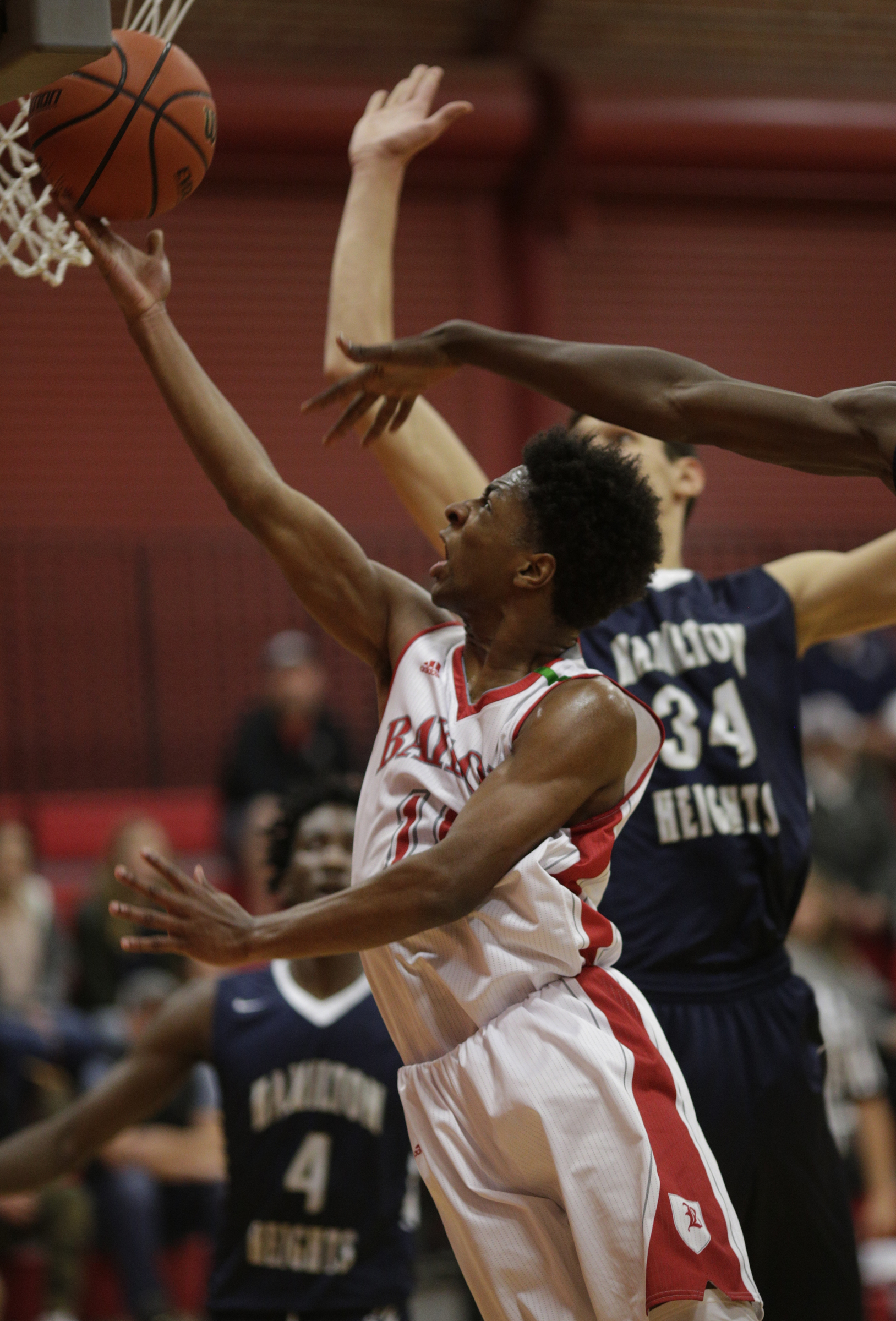 Baylor's Beyuan Hendricks shoots ahead of Hamilton Heights' Uros Plasvic during their prep basketball game at Baylor School on Tuesday, Dec. 5, 2017, in Chattanooga, Tenn.