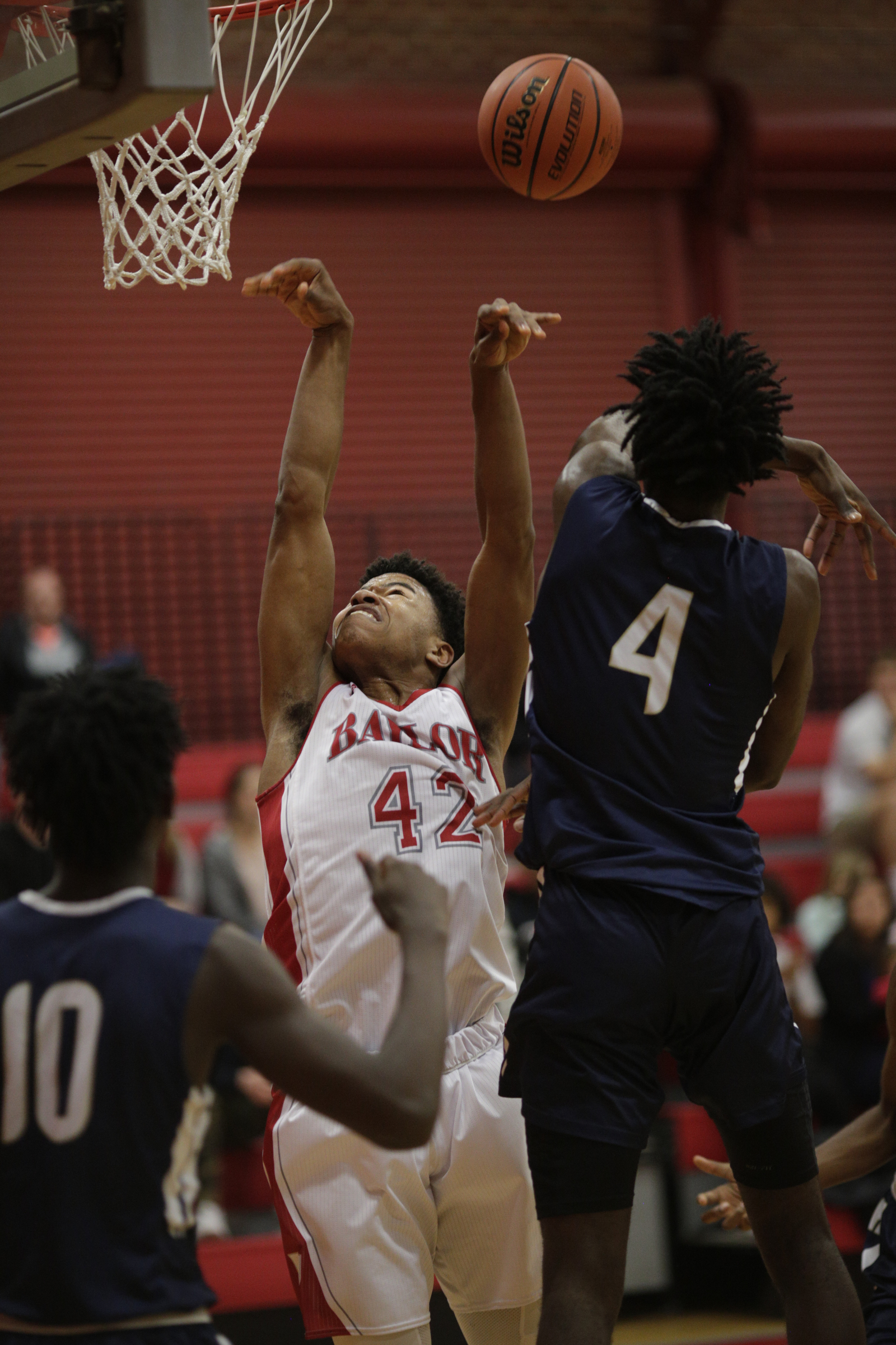 Baylor's Niko SImpkins (42) shoots between Hamilton Heights' Berke Tankus (4) and Thomasi Gilgeous-Alexander during their prep basketball game at Baylor School on Tuesday, Dec. 5, 2017, in Chattanooga, Tenn.