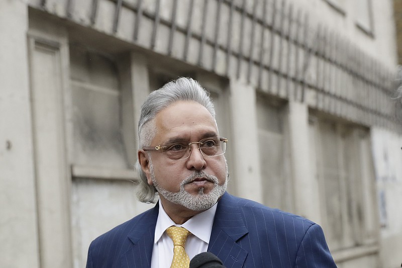
              F1 Force India team boss Vijay Mallya arrives for the second day of his extradition case at Westminster Magistrates Court in London, Tuesday, Dec. 5, 2017. Indian tycoon Vijay Mallya is set to faces an extradition hearing in London that should determine whether he is sent back to India to face money laundering allegations related to the collapse of several of his businesses. (AP Photo/Matt Dunham)
            
