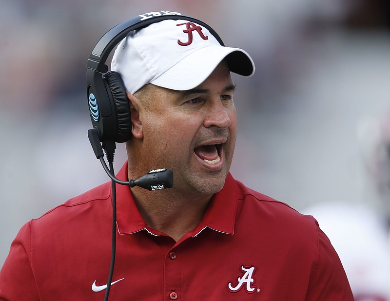 In this April 22, 2017, file photo, Alabama defensive coordinator Jeremy Pruitt, coach of the White team, yells to his team during Alabama's annual A-Day spring football game in Tuscaloosa, Ala. No. 1 Alabama and No. 6 Auburn bring two of the SEC's most dominating defenses into this marquee Iron Bowl showdown after reloading on that side of the ball following the departure of several starters. (Gary Cosby Jr./Tuscaloosa News via AP, File)