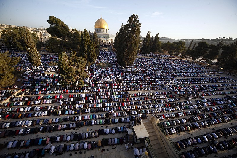 In this Sept. 24, 2015 file photo, Palestinians pray during the Muslim holiday of Eid al-Adha, near the Dome of the Rock Mosque in the Al Aqsa Mosque compound in Jerusalem's old city. Saudi Arabia has spoken out strongly against any possible U.S. recognition of Jerusalem as Israel's capital. In a statement on the state-run Saudi Press Agency, the Foreign Ministry said Tuesday, Dec. 5, 2017, that the kingdom affirms the rights of Palestinian people regarding Jerusalem which it said "cannot be changed." (AP Photo/Mahmoud Illean, File)