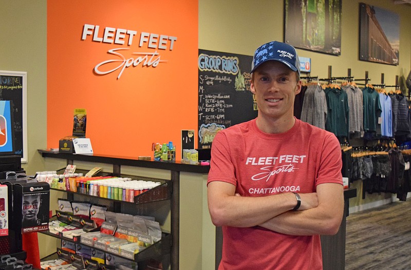 Local runner Christian Thompson poses inside the Fleet Feet store he manages on the North Shore Dec. 5, 2017. Thompson qualified for the Olympic trials. 