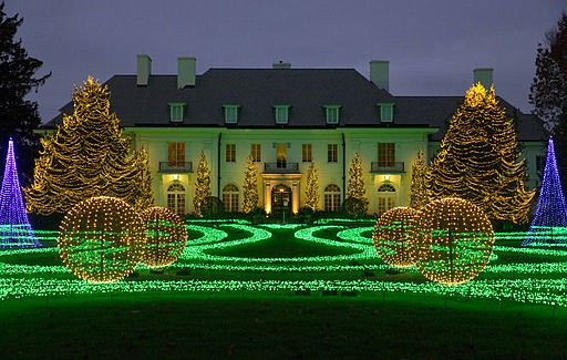 In this Nov. 16, 2017 photo, The Lilly House at Newfields is part of the Winterlights holiday light display on the museum's grounds in Indianapolis. The display on the lawn of the home is synchronized to music from the Nutcracker. (AP Photo/Michael Conroy)