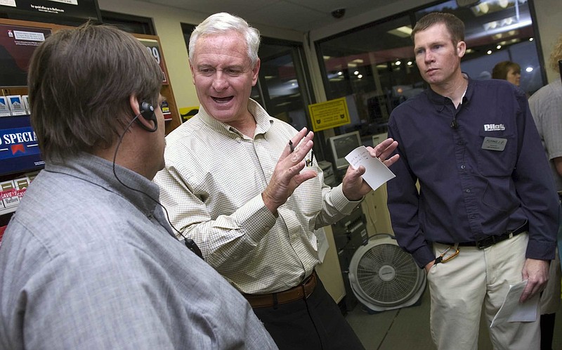 Jimmy Haslam, center, president and CEO of Pilot Travel Centers, visits with managers Gary Jones, left, and Jim Kennedy on Nov. 16, 2010, at the Flying J Travel Center on Watt Road in Knoxville. Pilot Travel Centers and Flying J merged in June 2010, with the company now operating more than 550 travel centers across North America.