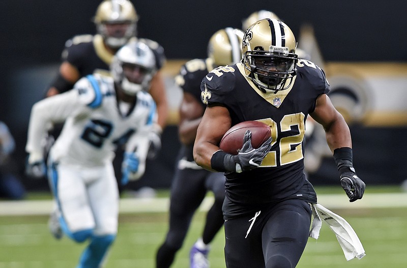 FILE - In this Sunday, Dec. 3, 2017, file photo, New Orleans Saints running back Mark Ingram (22) carries on a 72-yard run in the first half of an NFL football game against the Carolina Panthers in New Orleans, When the first-place New Orleans Saints face the Atlanta Falcons on Thursday night in an NFC South matchup with serious playoff ramifications, the spotlight will be on the guys in the backfield. (AP Photo/Bill Feig,FIle)