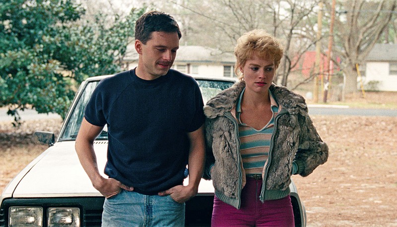 This image released by Neon shows Sebastian Stan as Jeff Gillooly, left, and Margot Robbie as Tonya Harding in a scene from "I, Tonya." (Neon via AP)