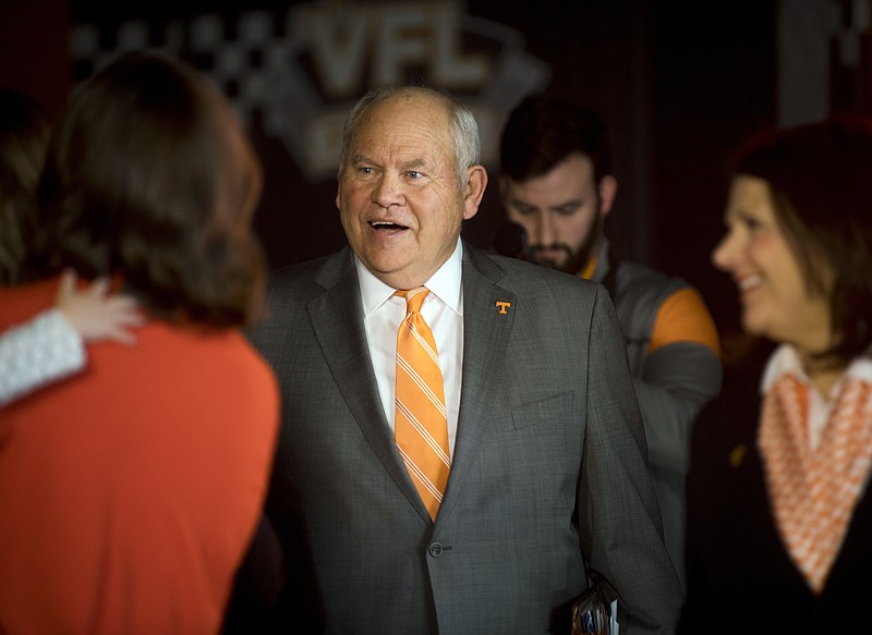 Phillip Fulmer follows University of Tennessee Chancellor Beverly Davenport, right, into a press conference, Friday, Dec. 1, 2017, in Knoxville, Tenn., where he was named athletic director at the university. The university placed former AD John Currie on paid leave amid what has been a tumultuous and embarrassing football coaching search. (Calvin Mattheis/Knoxville News Sentinel via AP)